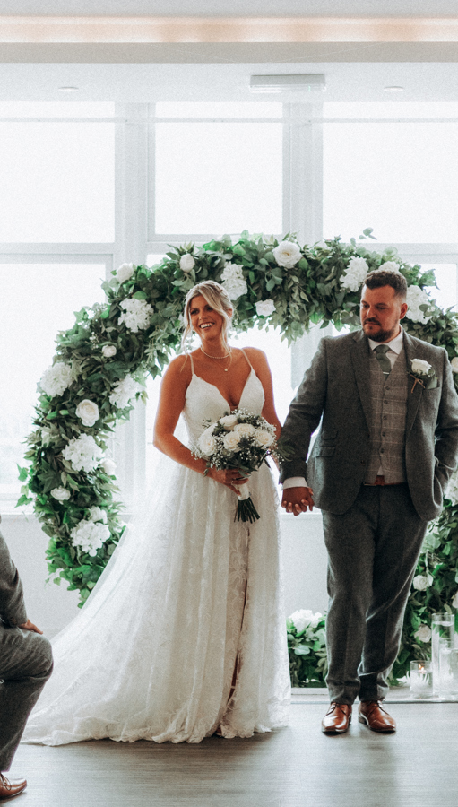 An indoor wedding ceremony with a sea view at Harbour Hotel St Ives