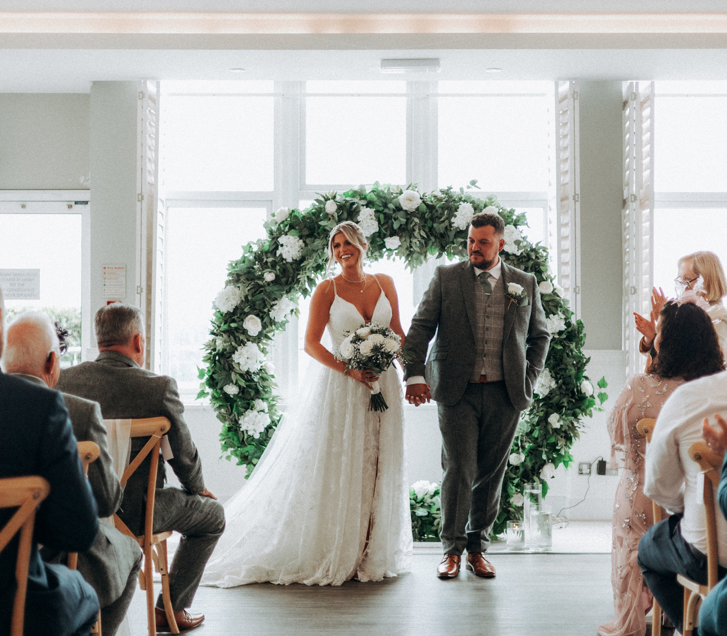 An indoor wedding ceremony with a sea view at Harbour Hotel St Ives